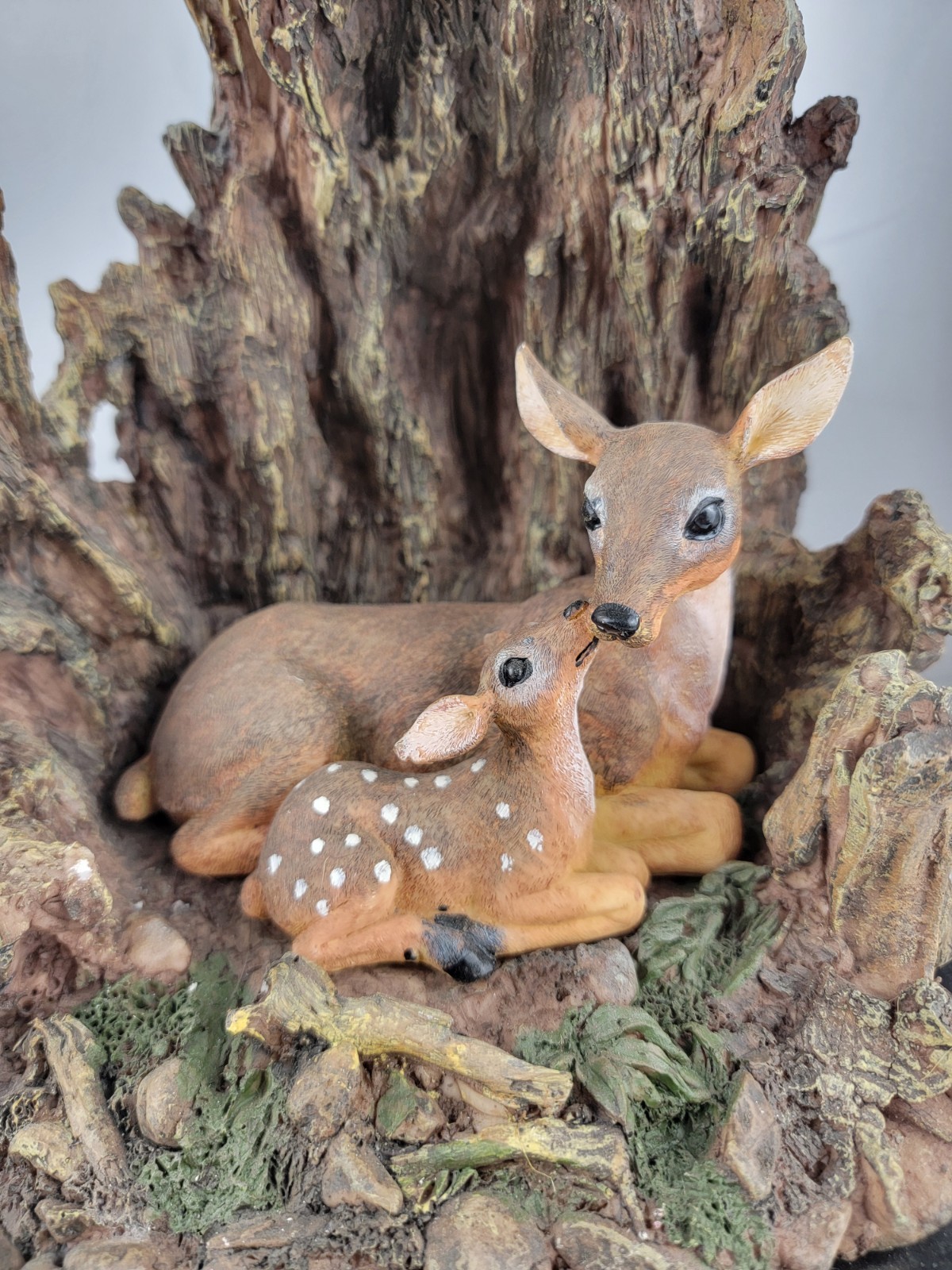 12″ Masterpiece Resin Deer, Fawn Resting Cave/ Tree Trunk Wodeen Base