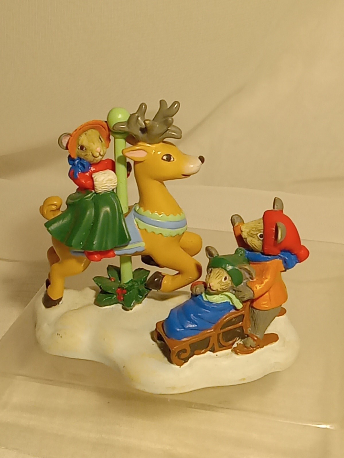 Avon Carousel Family Sledding Figurine by Kathy Jeffers 1993 Christmas