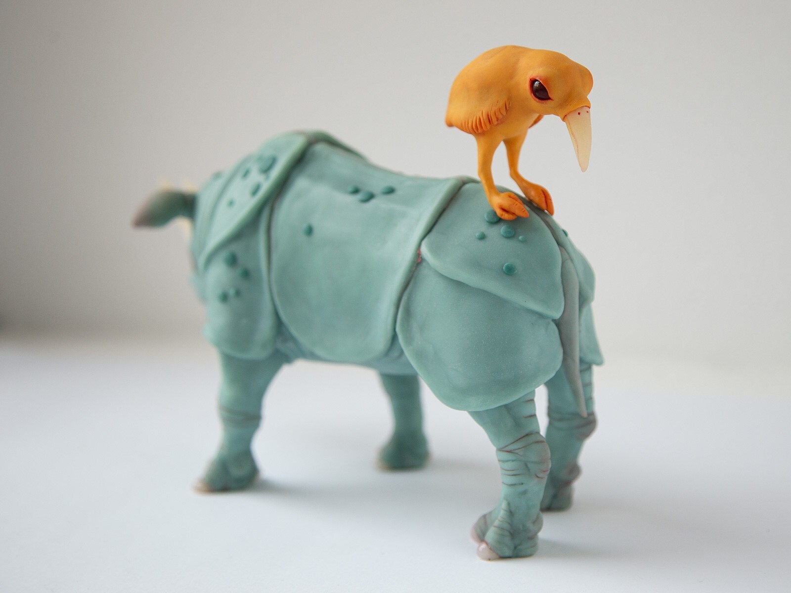 Perfect marriage – weird sculpture gift for couple, rhino and bird family statue
