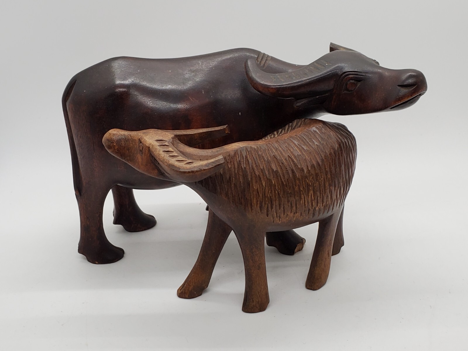 Pair of Vintage Hand Carved ebony teak buffalo – 2 sizes – mother and calf