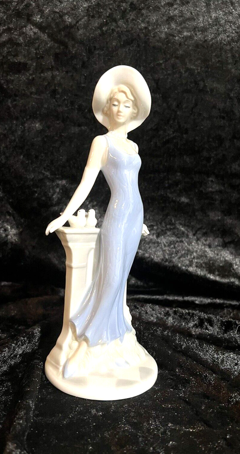 Art Deco Style Porcelain Statue Demure Woman Reflecting by Fence with Birds