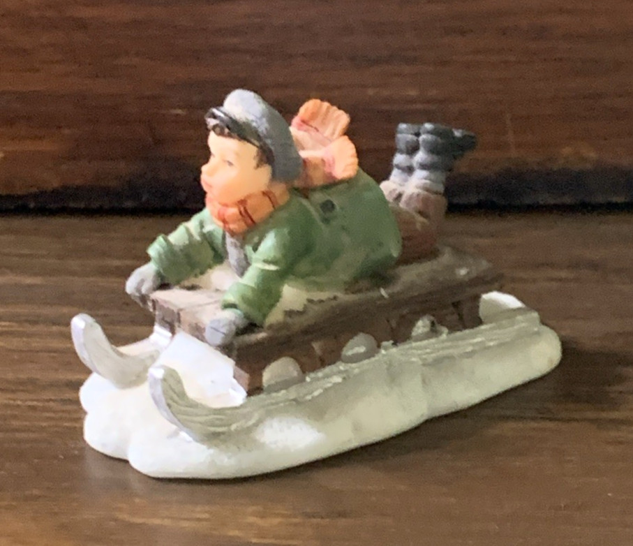 Boy Sleigh Riding Figurine Christmas