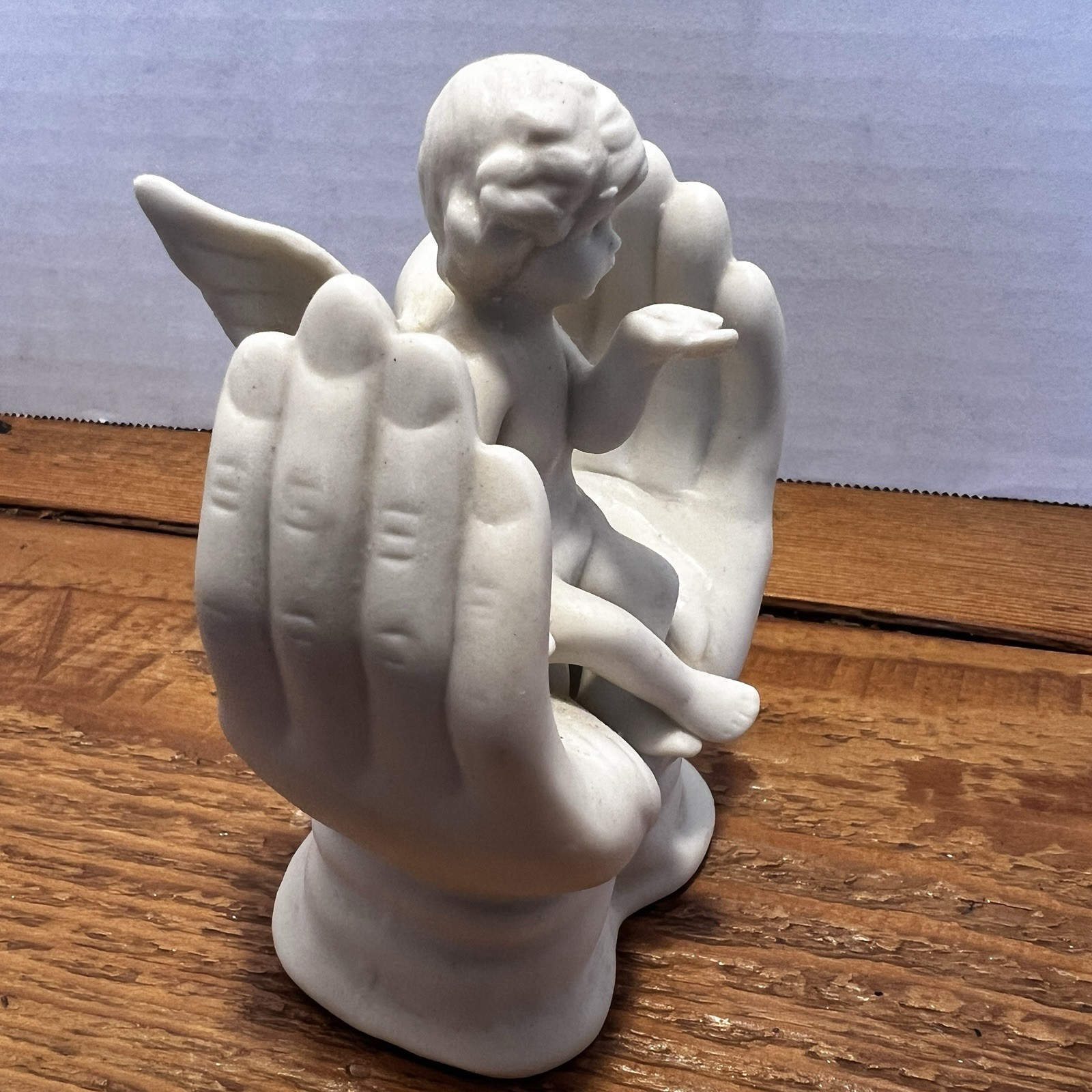 Vintage White Porcelain Figurine~Cherub Angel Sitting in Praying Hands~BEAUTIFUL