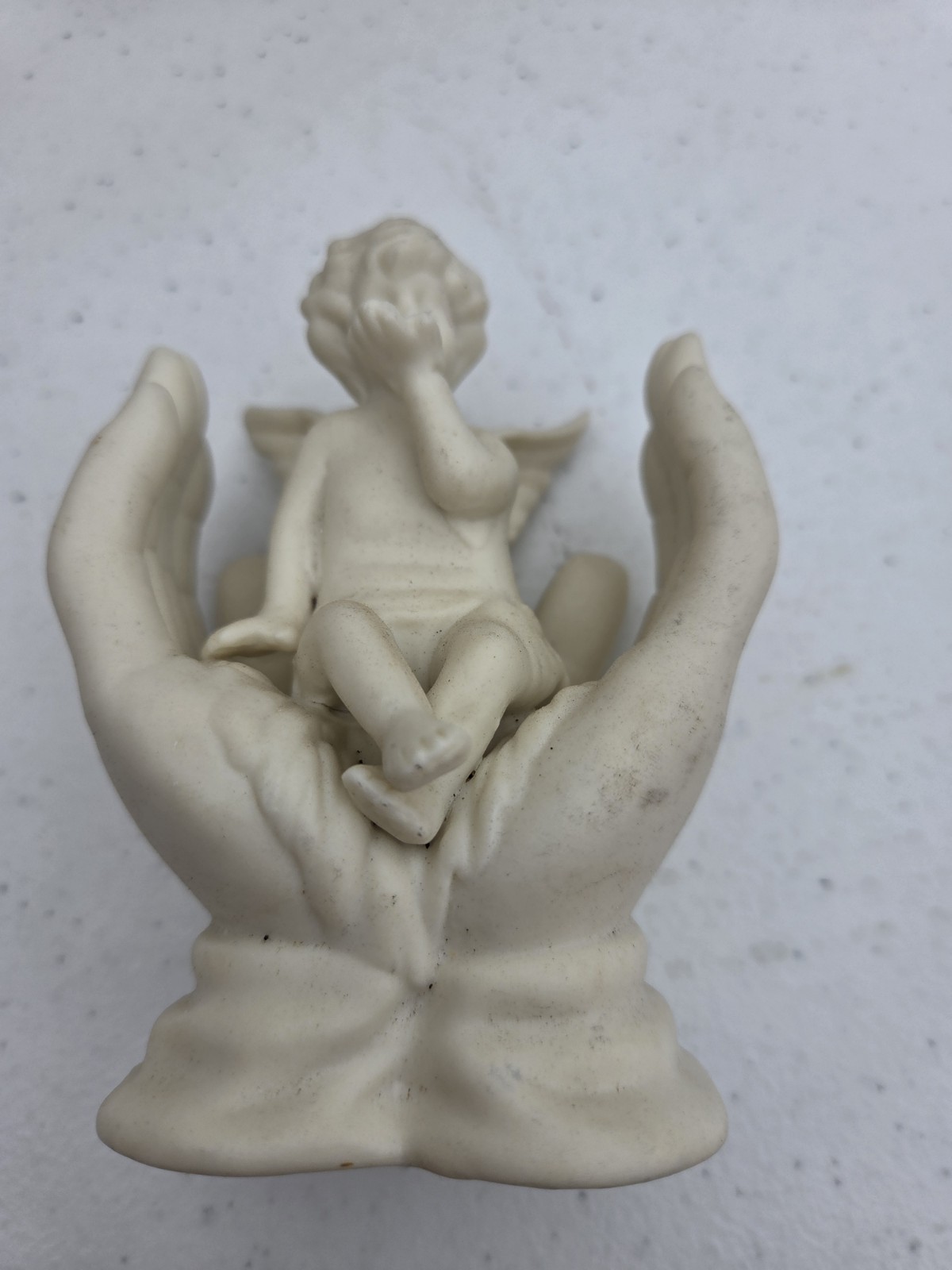 Vintage White Bisque Porcelain Cherub Angel Sitting in Hands Figurine – 4″ Tall