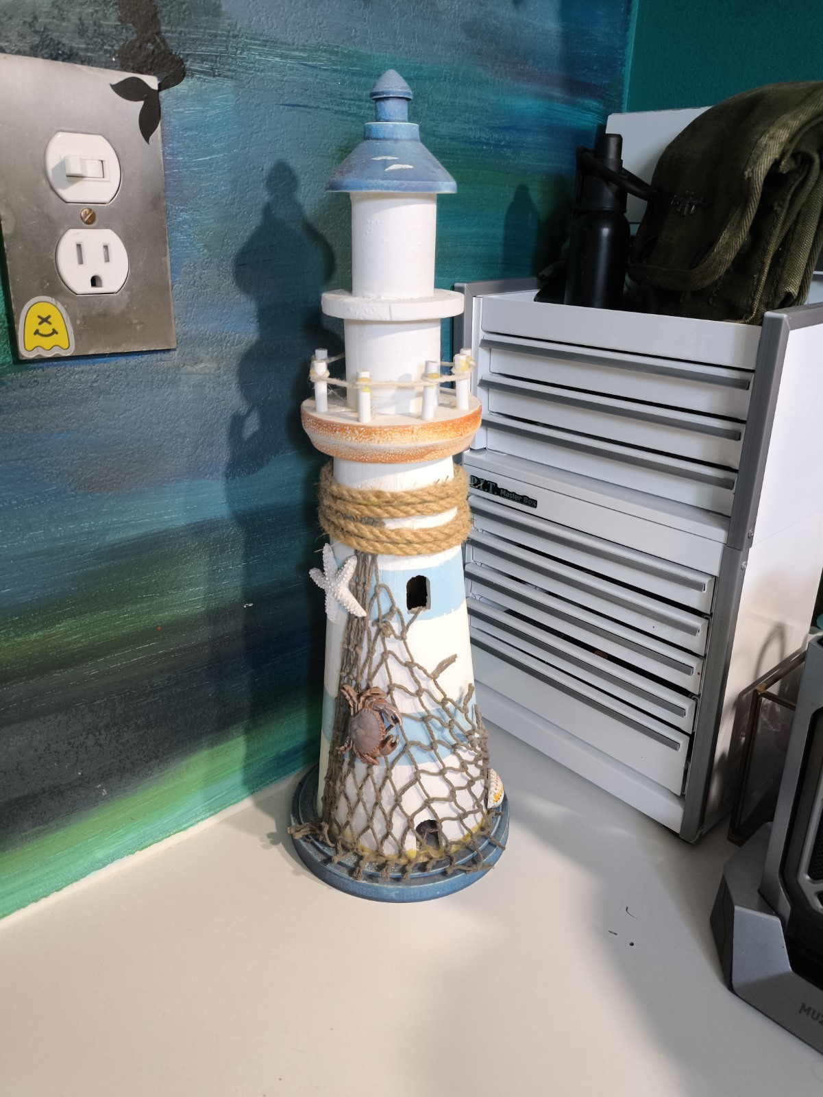 blue and white wooden lighthouse sculpture 16.5 Inches Tall