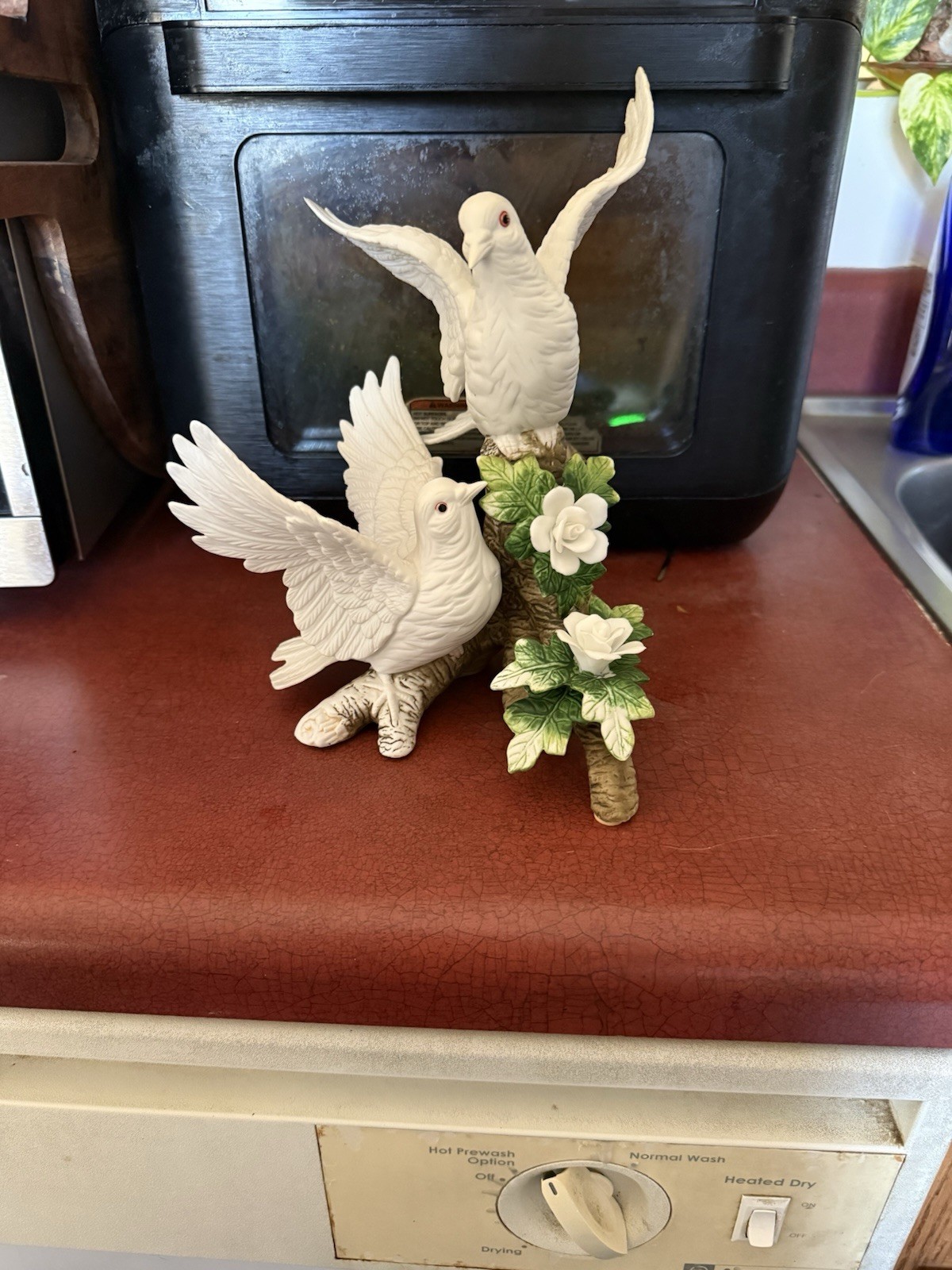 Vintage 1980s white ceramic dove figurine with green leaves and white flowers