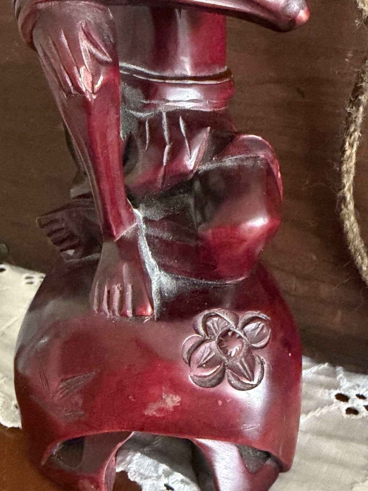 vintage hand-carved wood statue, often referred to as a “Fasting Buddha”