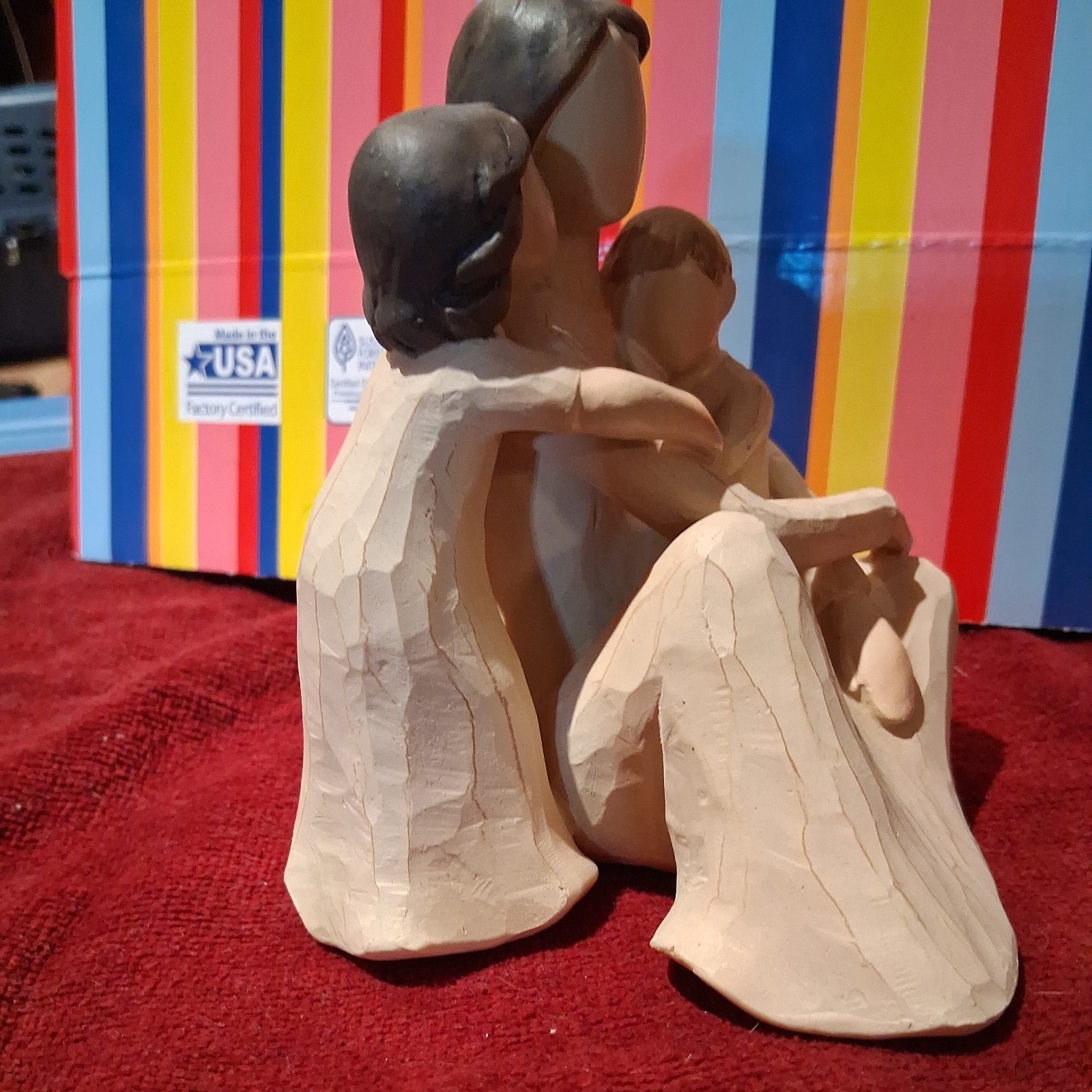 Mother Figurine holding children quietly .medium size..unmarked