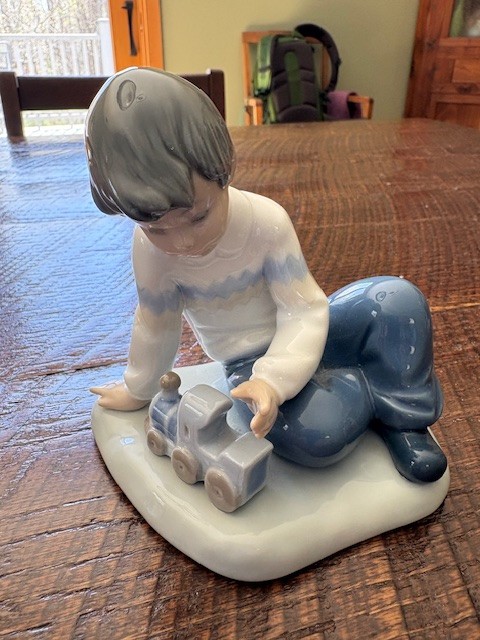 NAO by Lladro – “A Boy and His Train” or “A New Toy” – Model # 1052