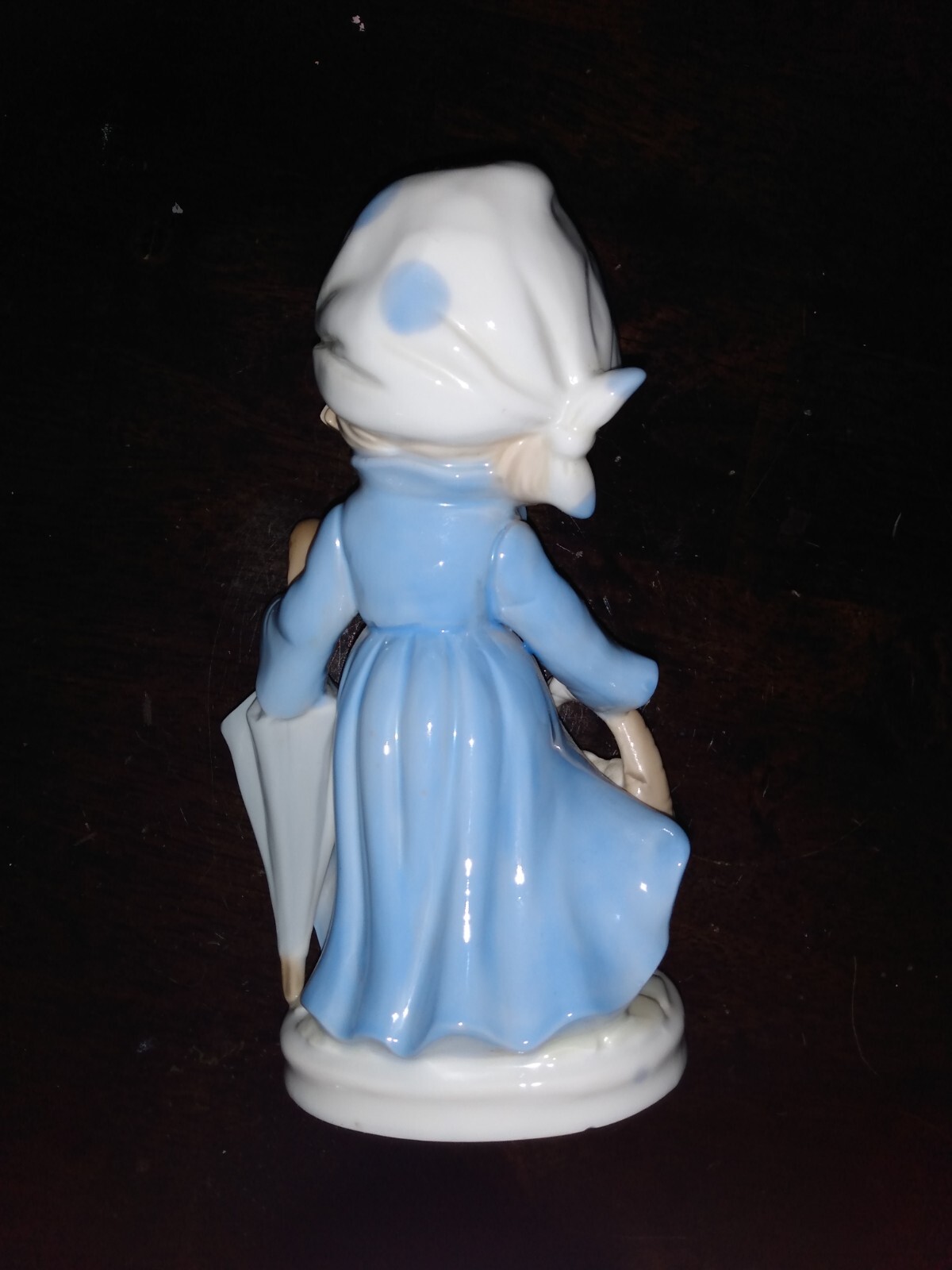 Vintage KMP porcelain girl figurine 7 7/8 inch with umbrella and basket.