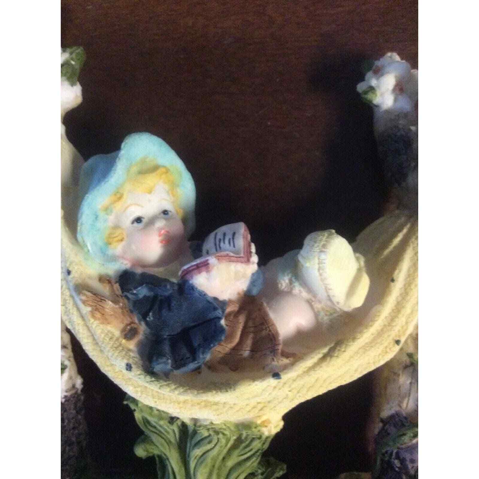 Boy Reading Book In Hammock Surrounded By Nature 6″ Tall Resin Figurine