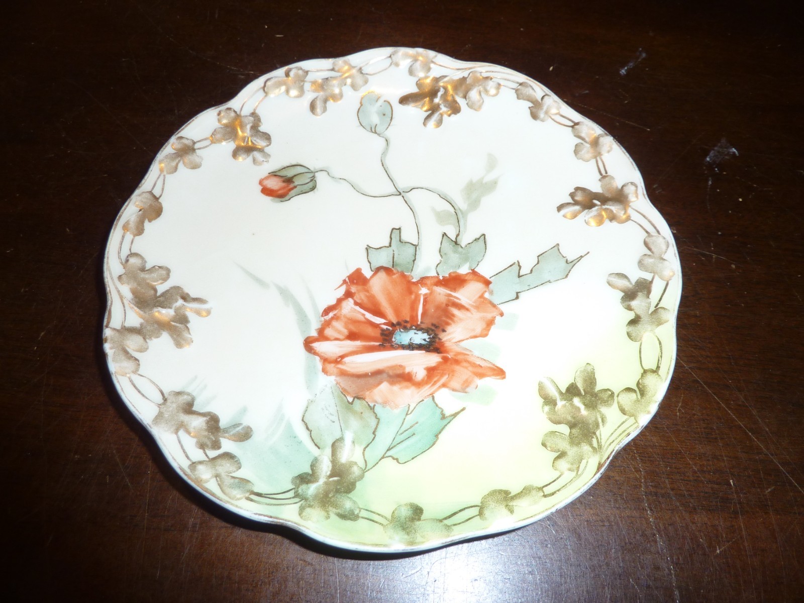 Karlsbad of Austria hand painted 6″ burnt orange poppies / gold trim plate
