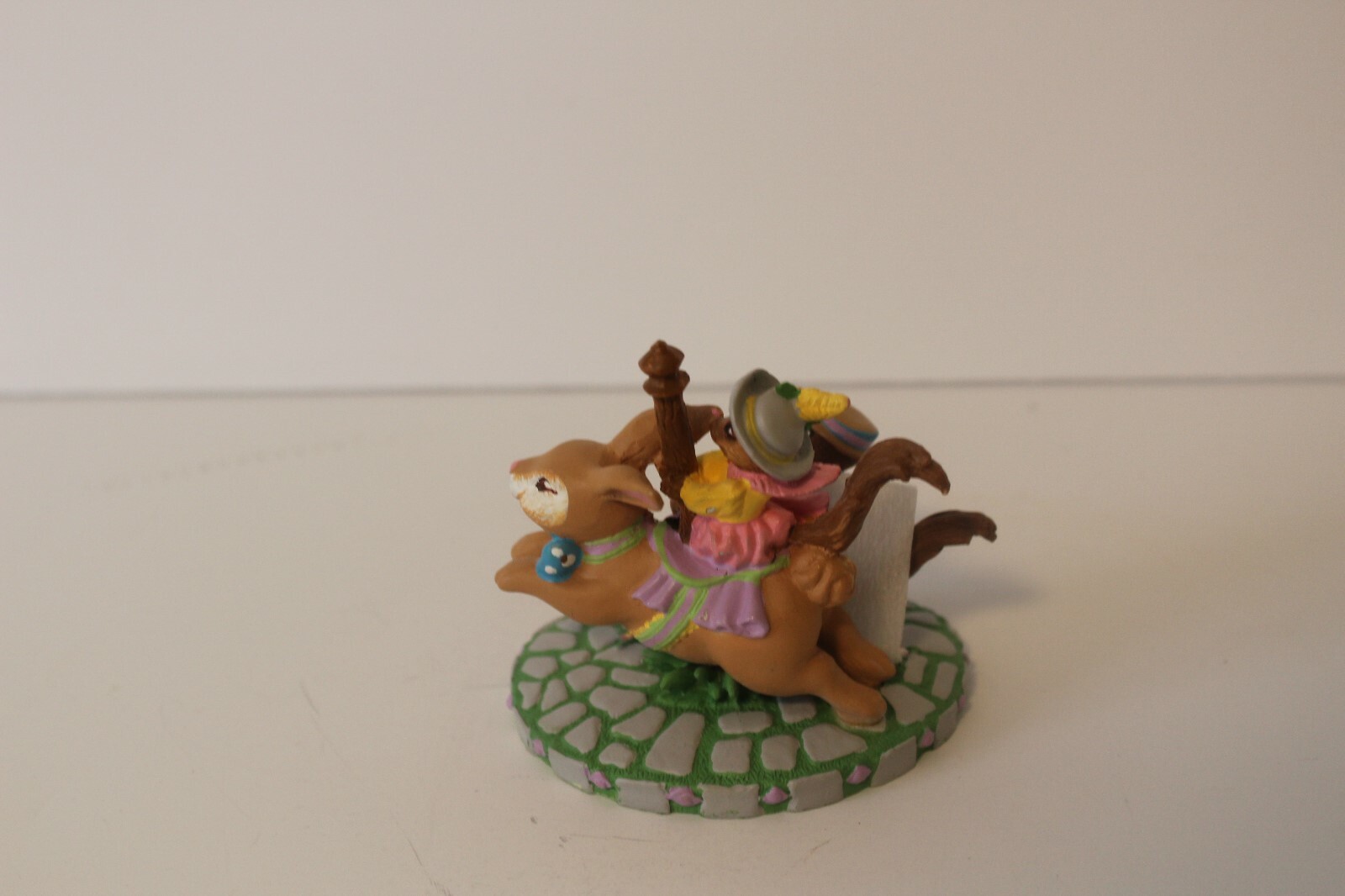 CAROUSEL SQUIRRELS on RABBIT BY KATHY JEFFERS 1993 AVON FIGURINE