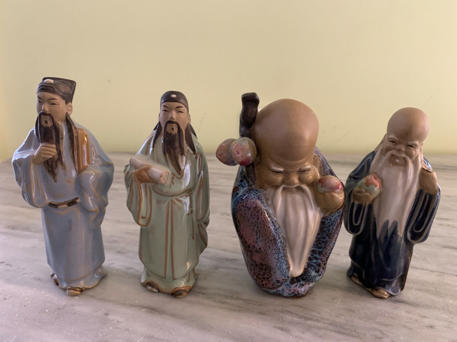 SET OF 4 CLAY FIGURES MADE IN CHINA