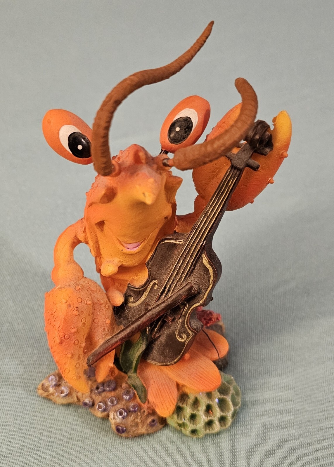 Playfull Sea Creature Figurine Playing Cello