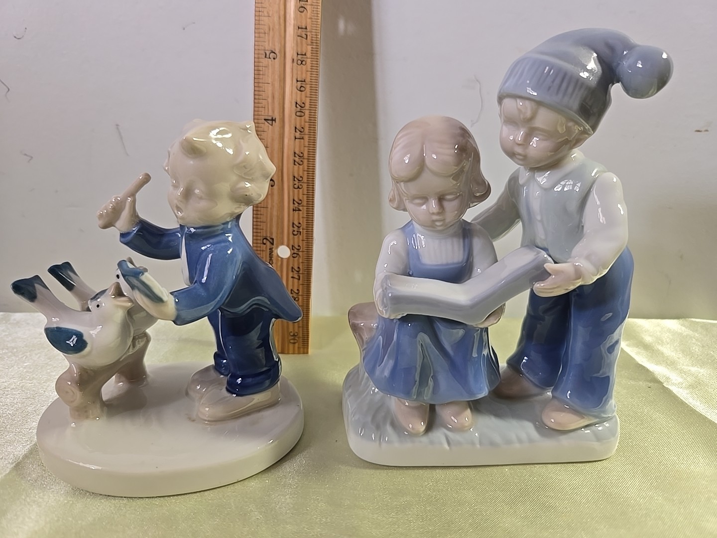 Two Figurines. Boy And Girl Reading. Boy Conductor.