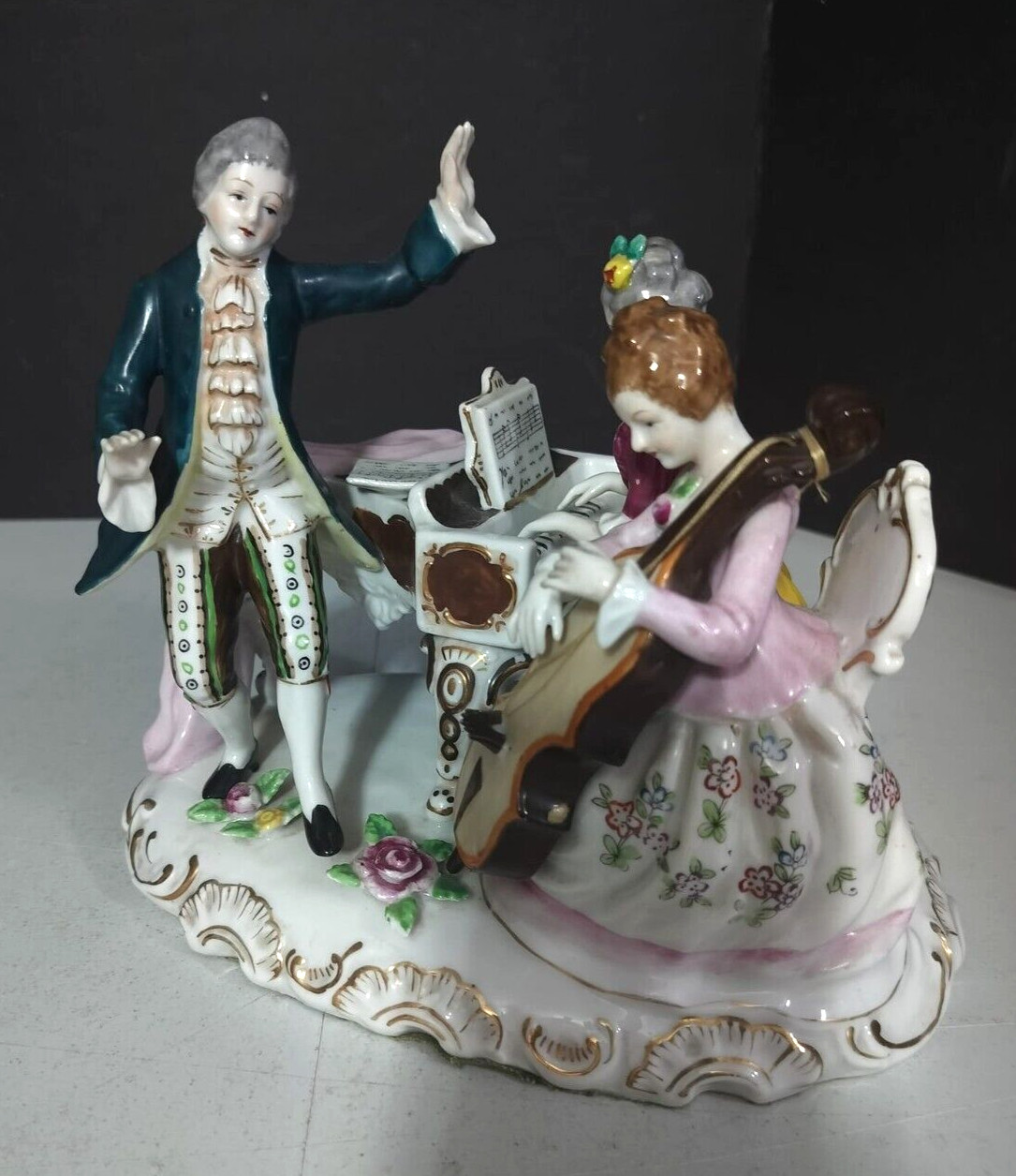 Antique Continental Porcelain Figurine Group, 7″ x 8.5″.