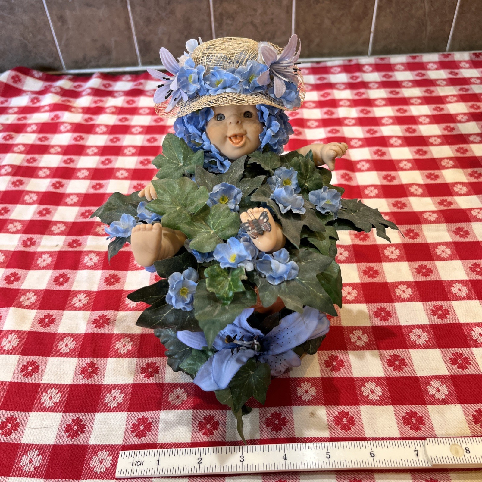 Hand crafted Floral Doll Curio Sitting in a Terracotta Pot