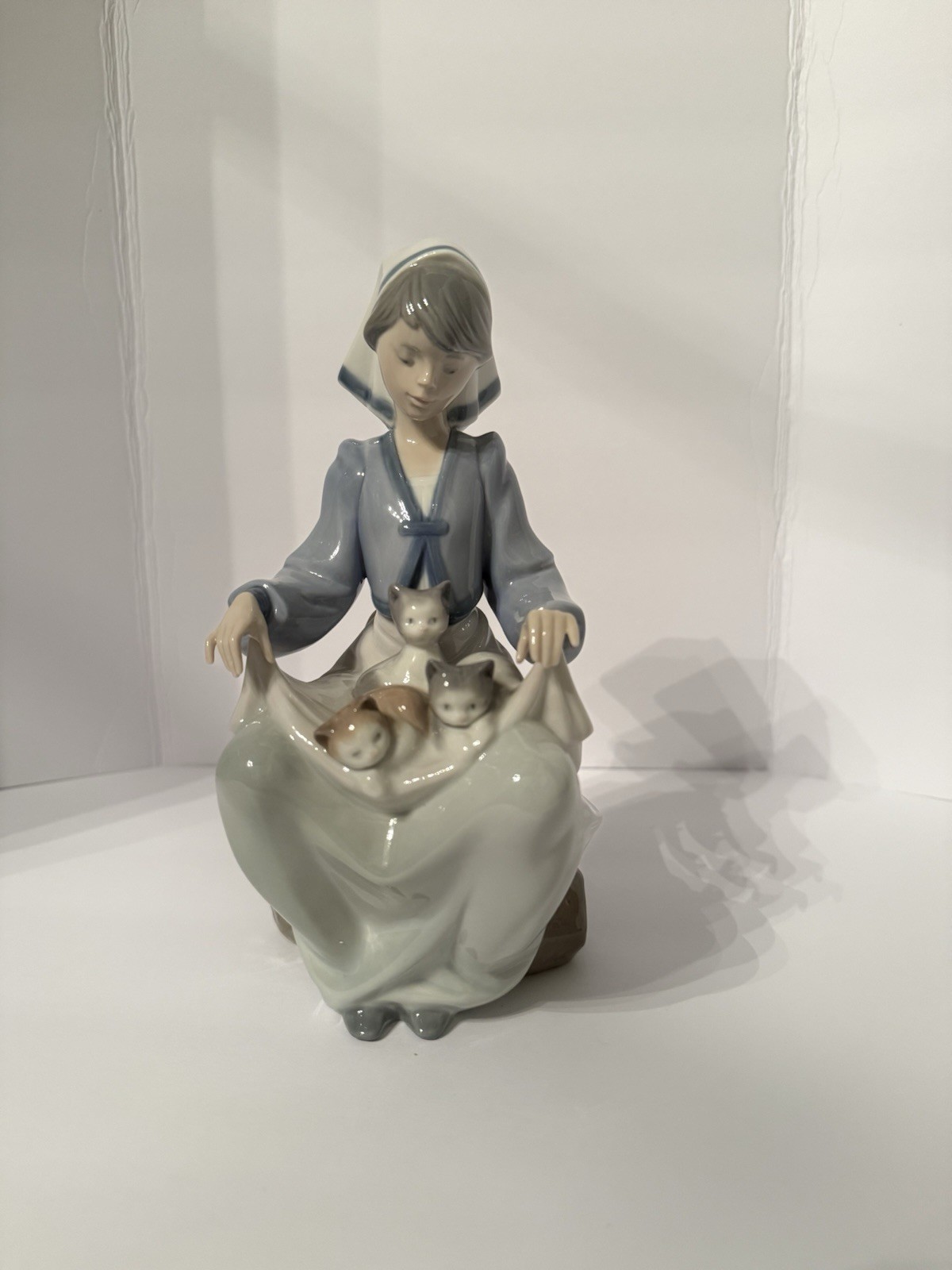 Lladró porcelain figurine titled “Lap Full of Love” (#5739)