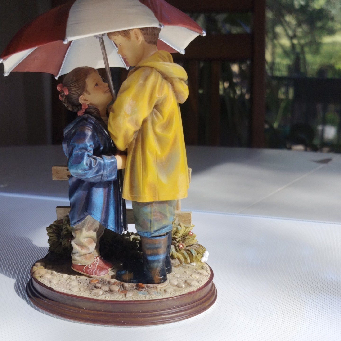 Mama says share by Kathy Andrews Fincher figurine boy, and girl with umbrella