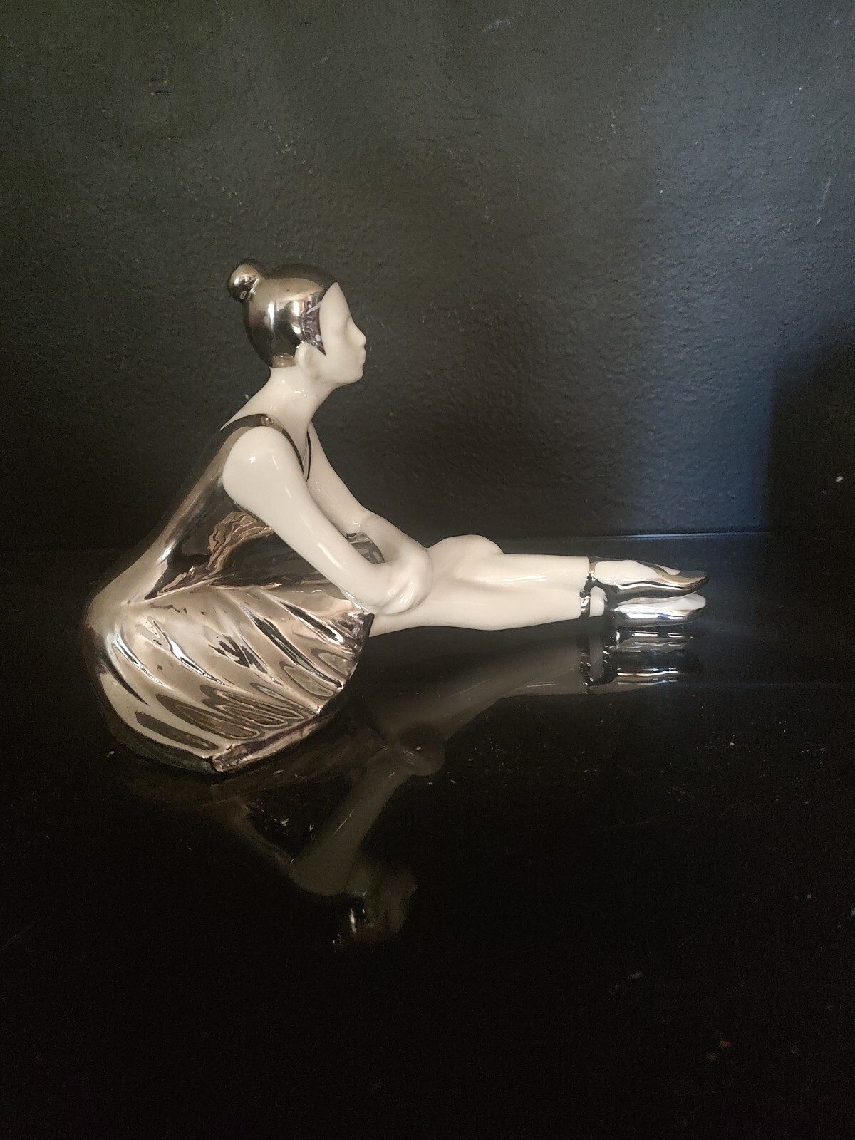 WHITE AND SILVER PORCELAIN SITTING BALLERINA FIGURINE. 9″L x 6″H X 5″W