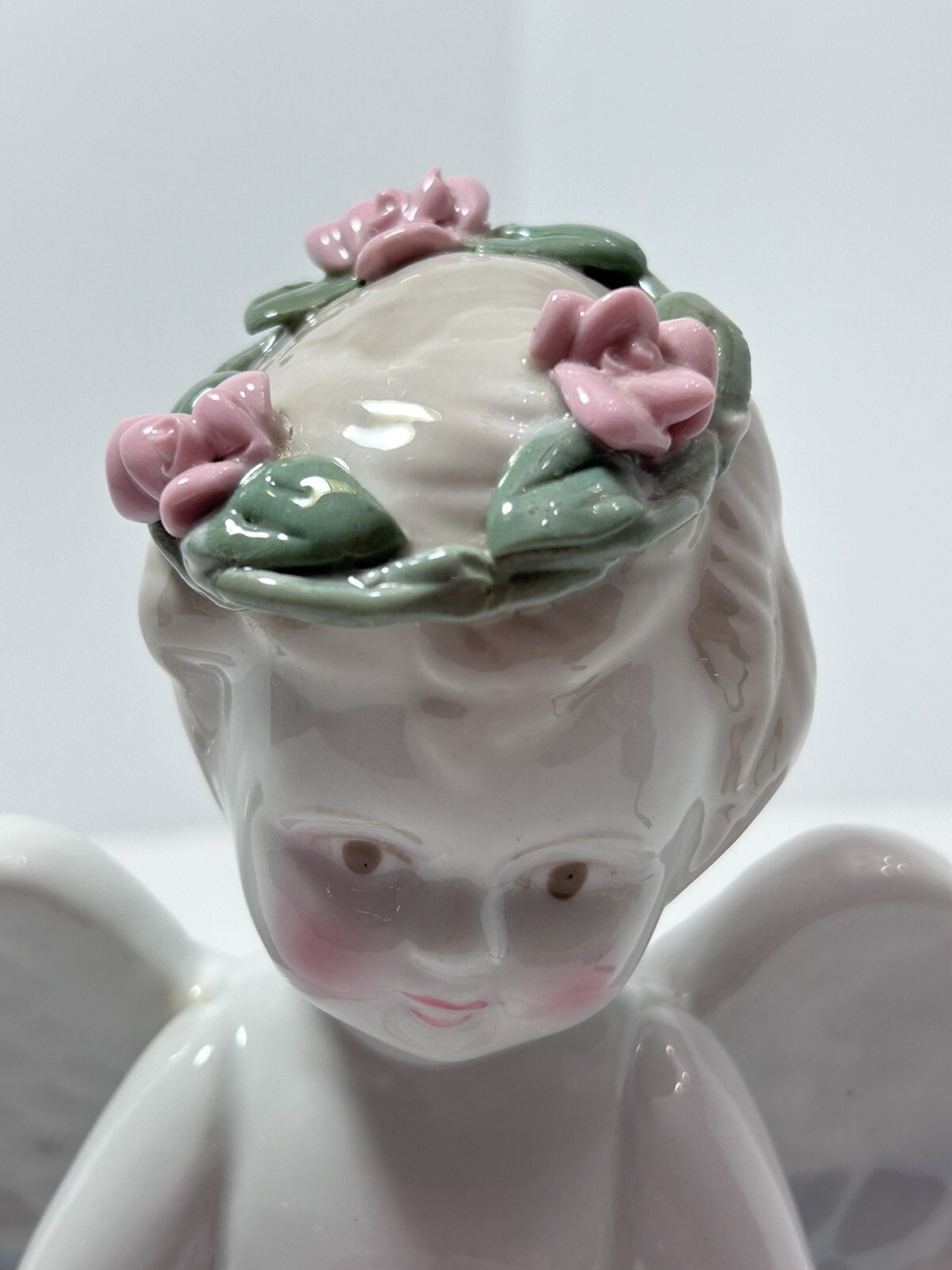 White Ceramic Kneeling Angel Holding Rose Cherub with Rose Wreath Garland 6”