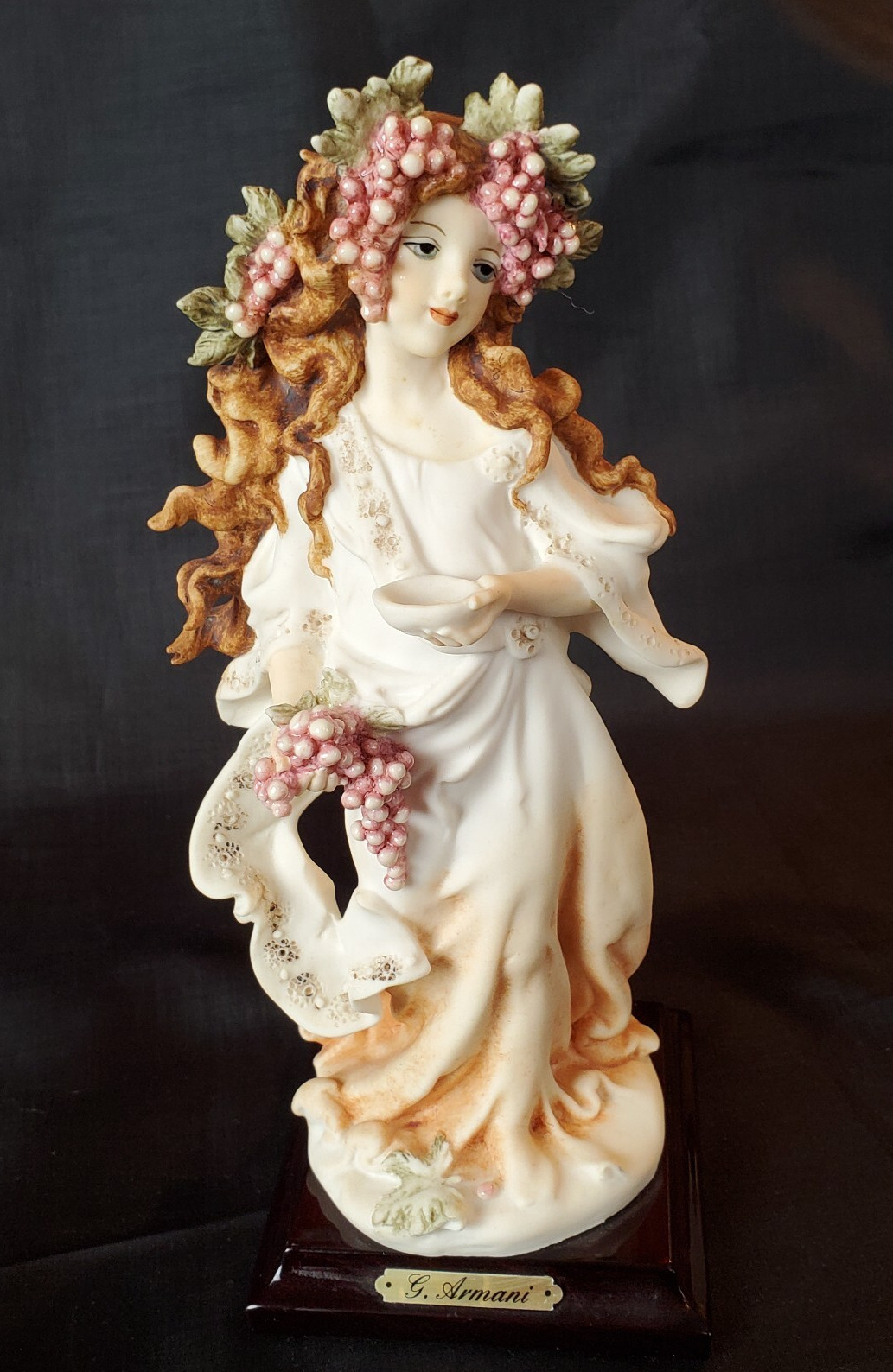 G. Armani Young Lady Figurine w/Grape Crown on Square Wood Base 8.5″H