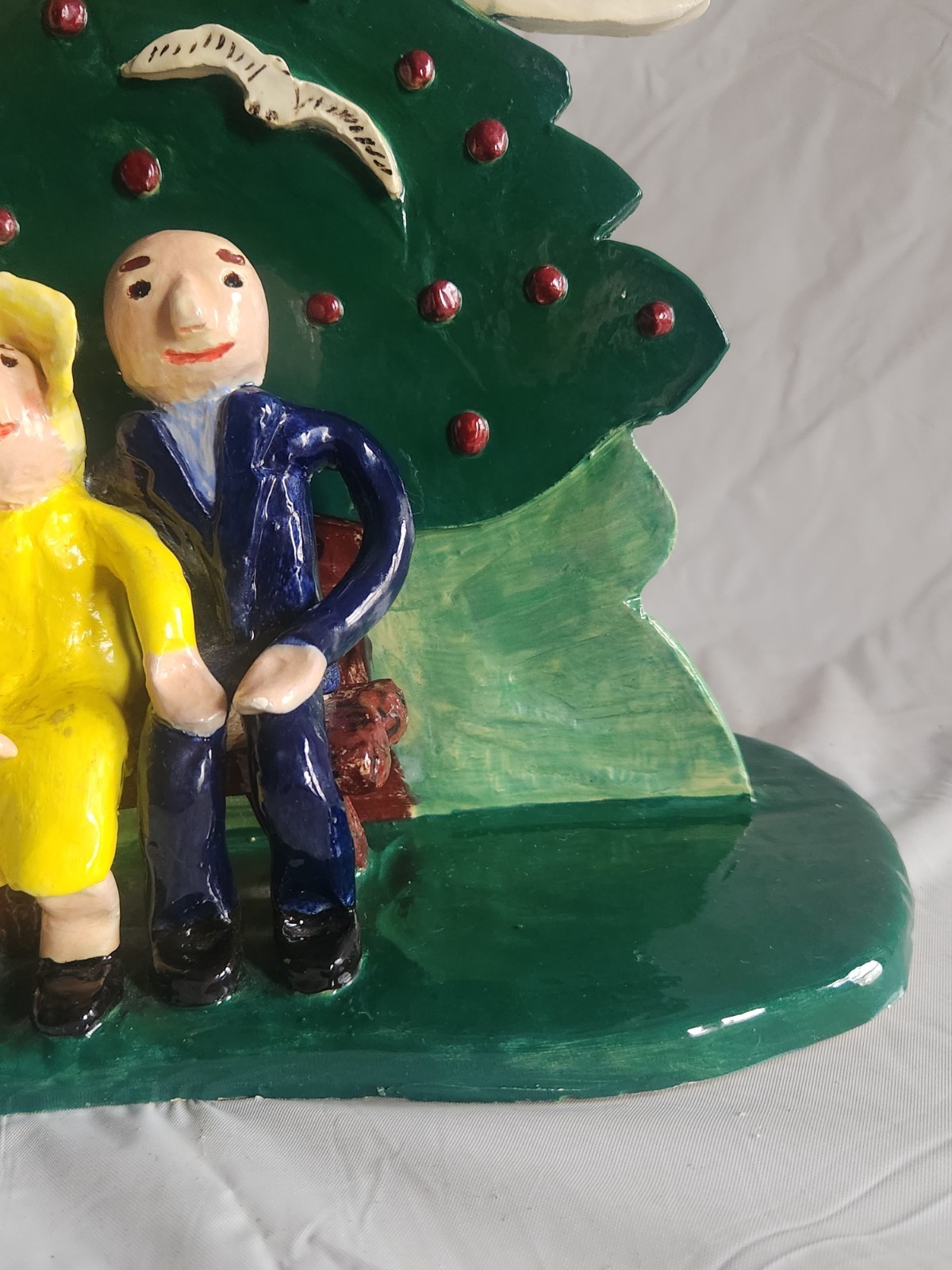 Handcrafted Ceramic Folk Art Style Figure of Couple Sitting on Bench Under Tree