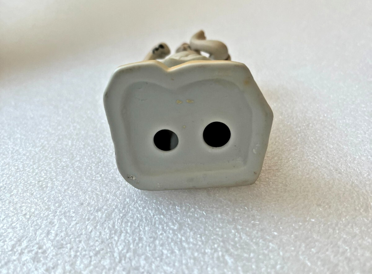 Vintage Porcelain Dentist Figurine Holding extracted tooth