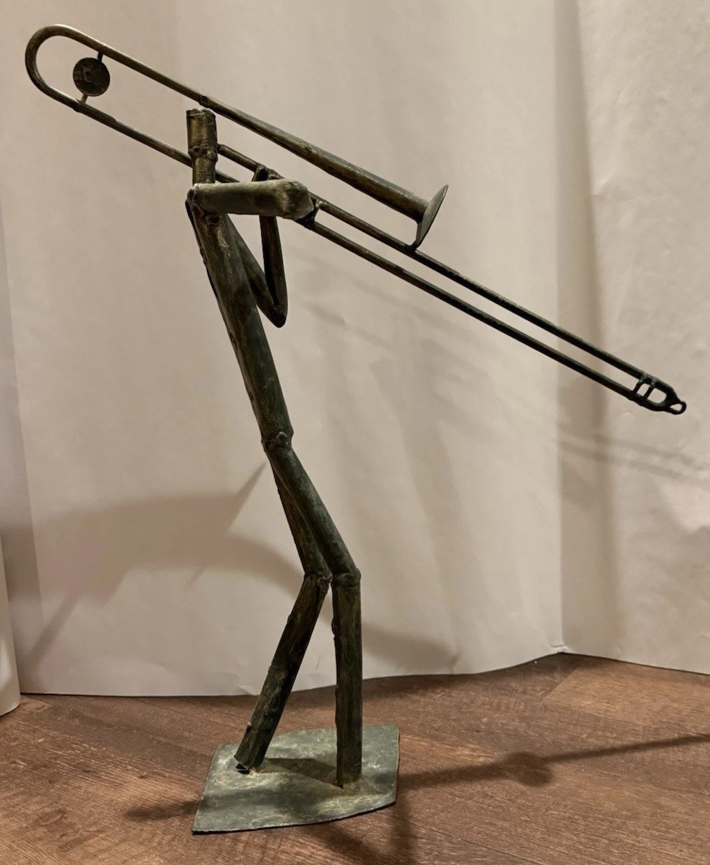 Vintage Z Gallerie tube metal sculpture of a jazz trombone player, 17 in tall.