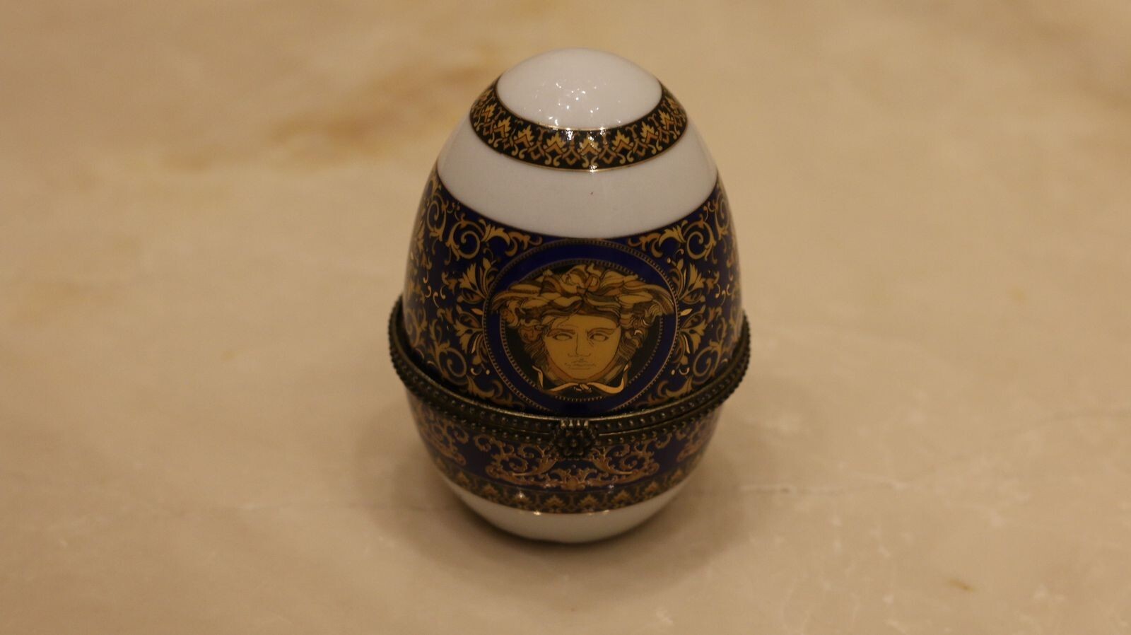 Versace Designs egg in white bohemian porcelain with blue and gold Medusa