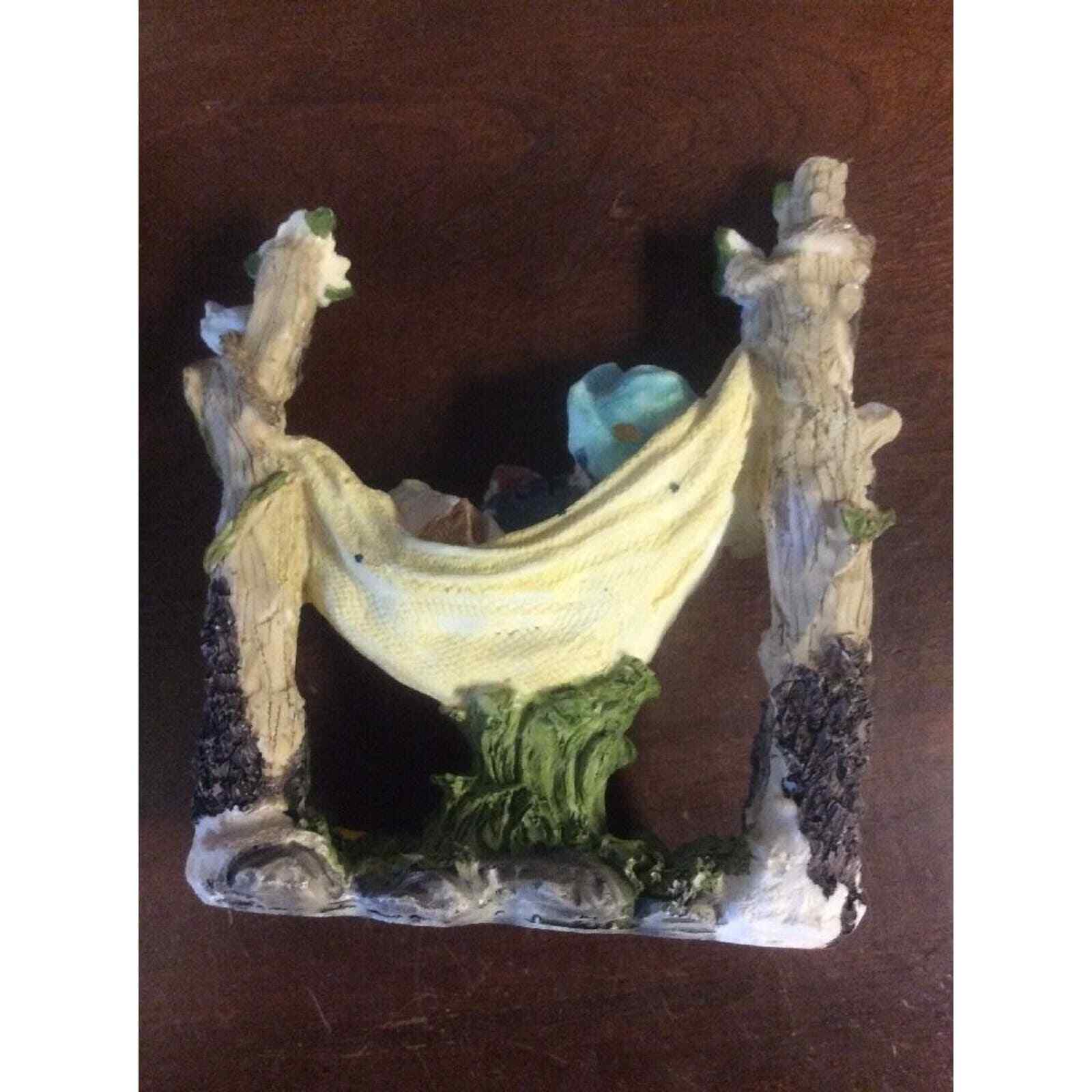 Boy Reading Book In Hammock Surrounded By Nature 6″ Tall Resin Figurine
