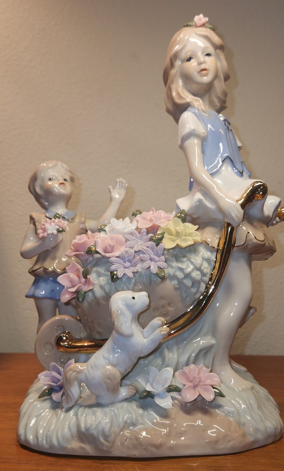 Lladro “Style” Porcelaine Figure of 2 Girls w/Dog And Flowers In A Wheelbarrow