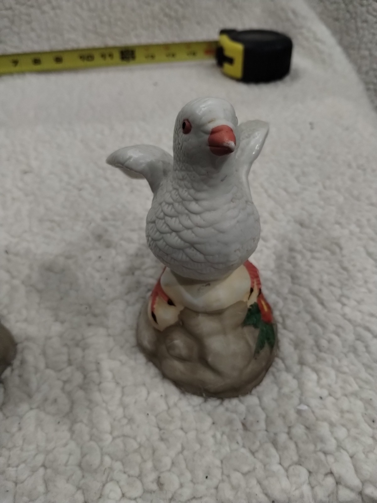 Two Ceramic Doves Wings Back With Red And Green Flowers.