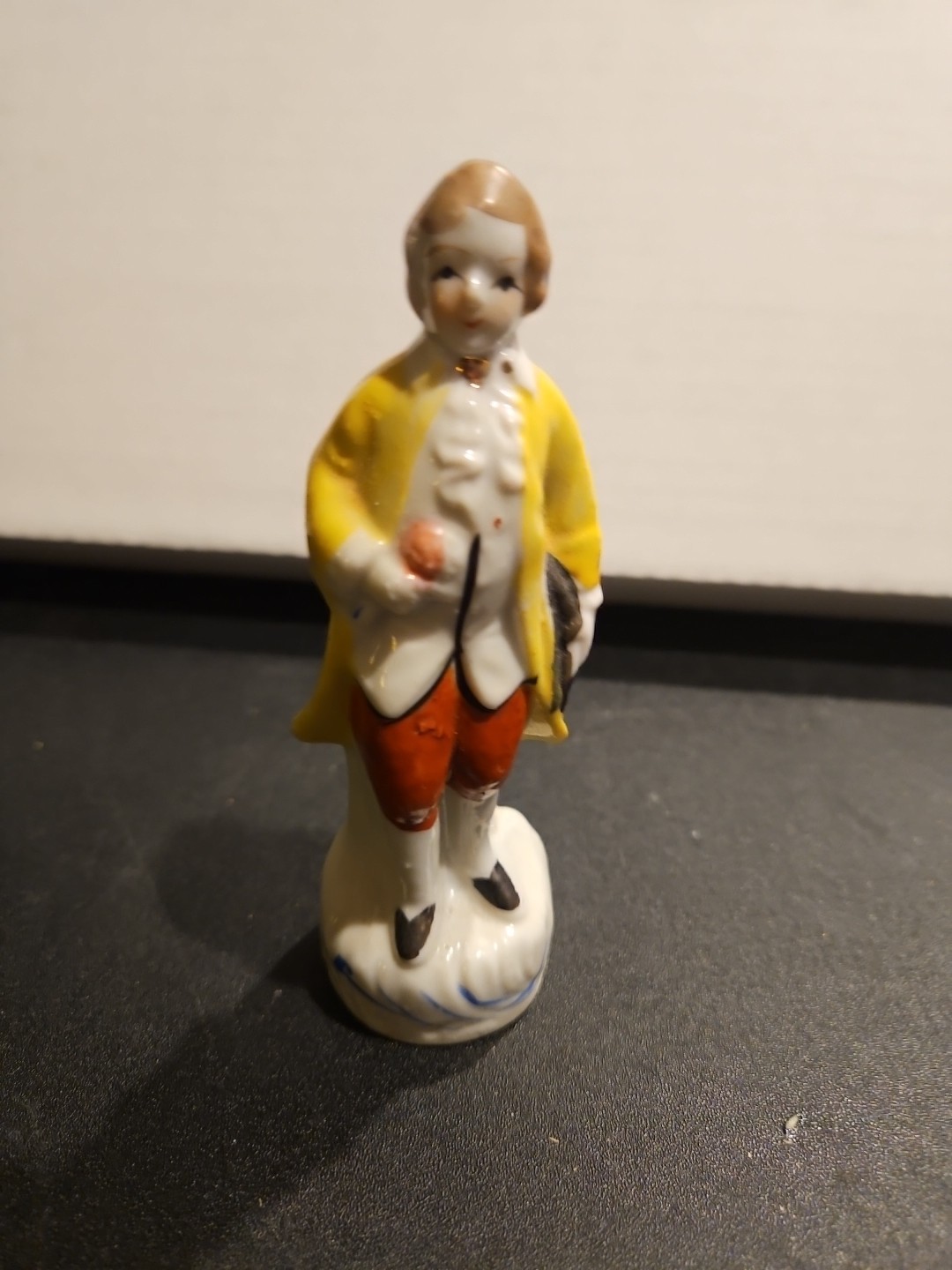 3 3/4″ Occupied Japan Colonial Gentleman wearing a yellow coat