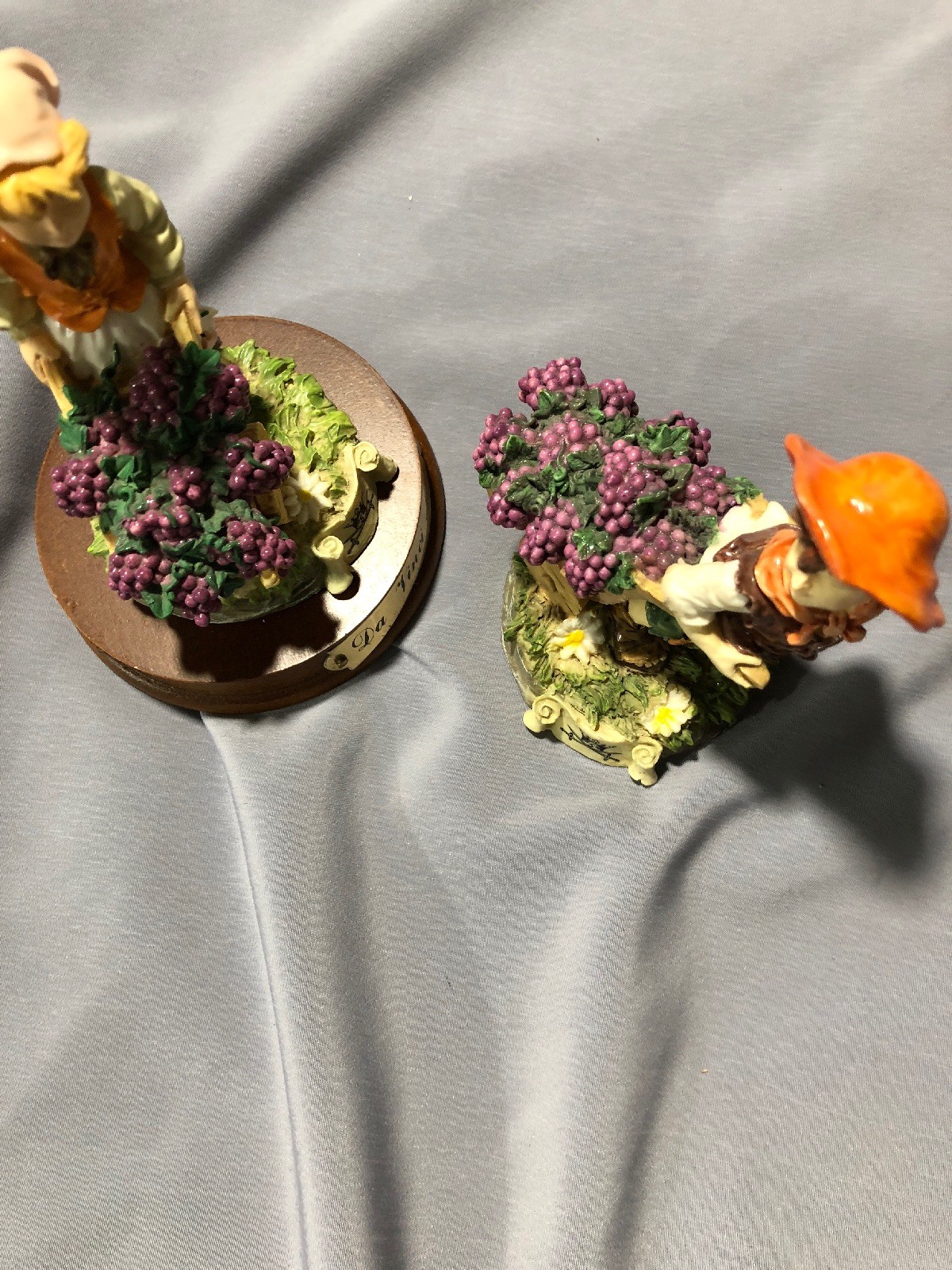 DaVinci Collection – A pair of Figurines – Boy and Girl with grapes in barrows