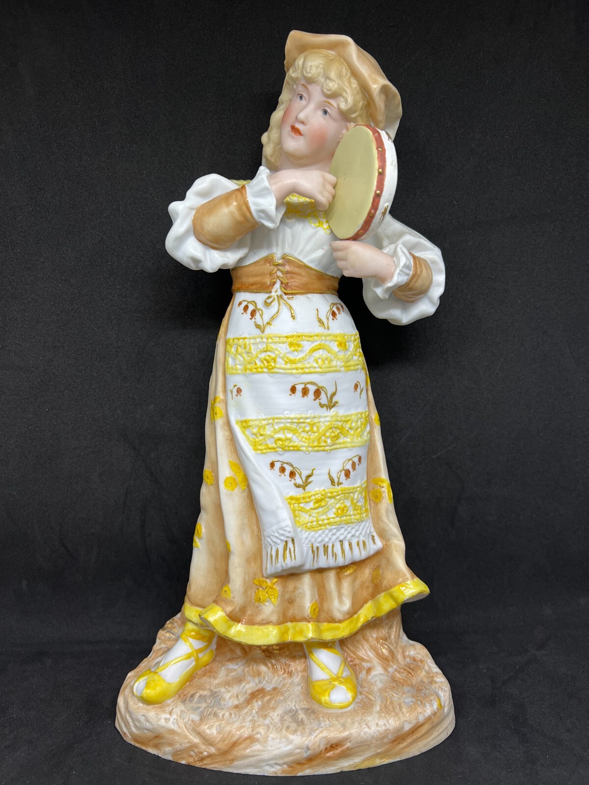 Gebruder Heubach-German Bisque-A Girl Holding & Playing Her Tambourine 14 1/2″