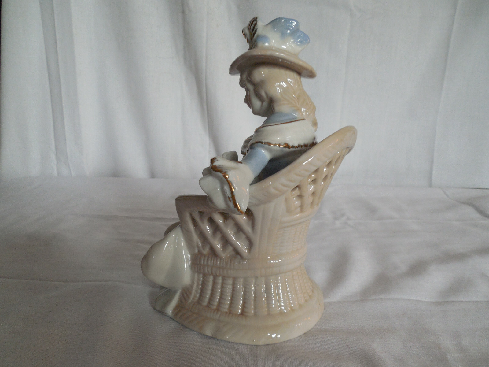 Vintage blue porcelain lady sitting in chair figure 7.5″