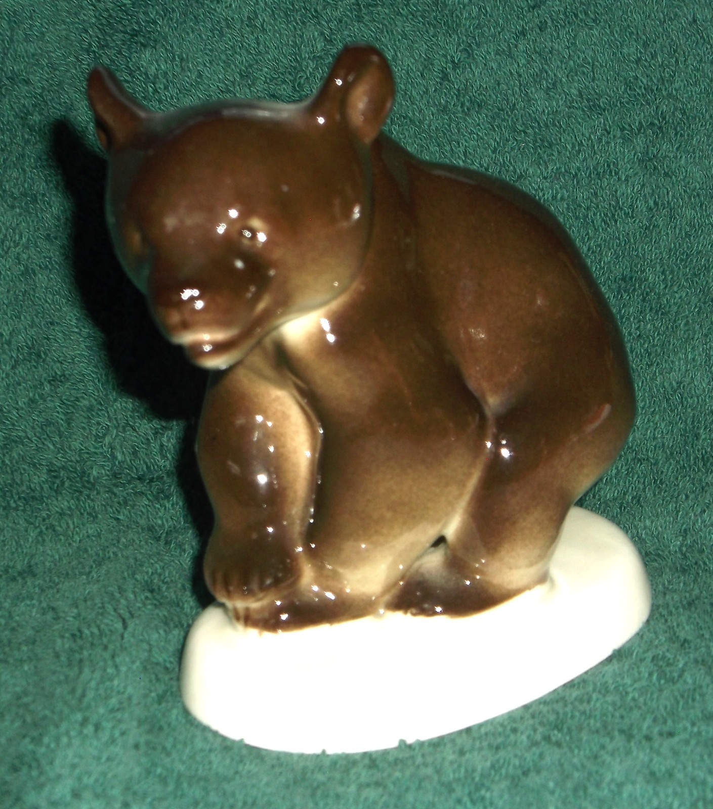 Lomonosov Russian ceramic dark brown bear on white ceramic stand