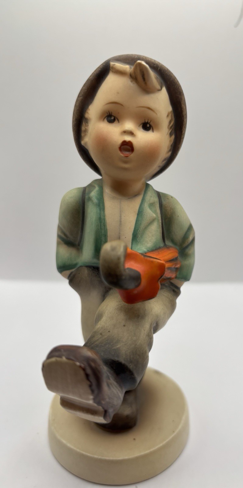 vintage Goebel Hummel figurine titled “Happy Traveler”