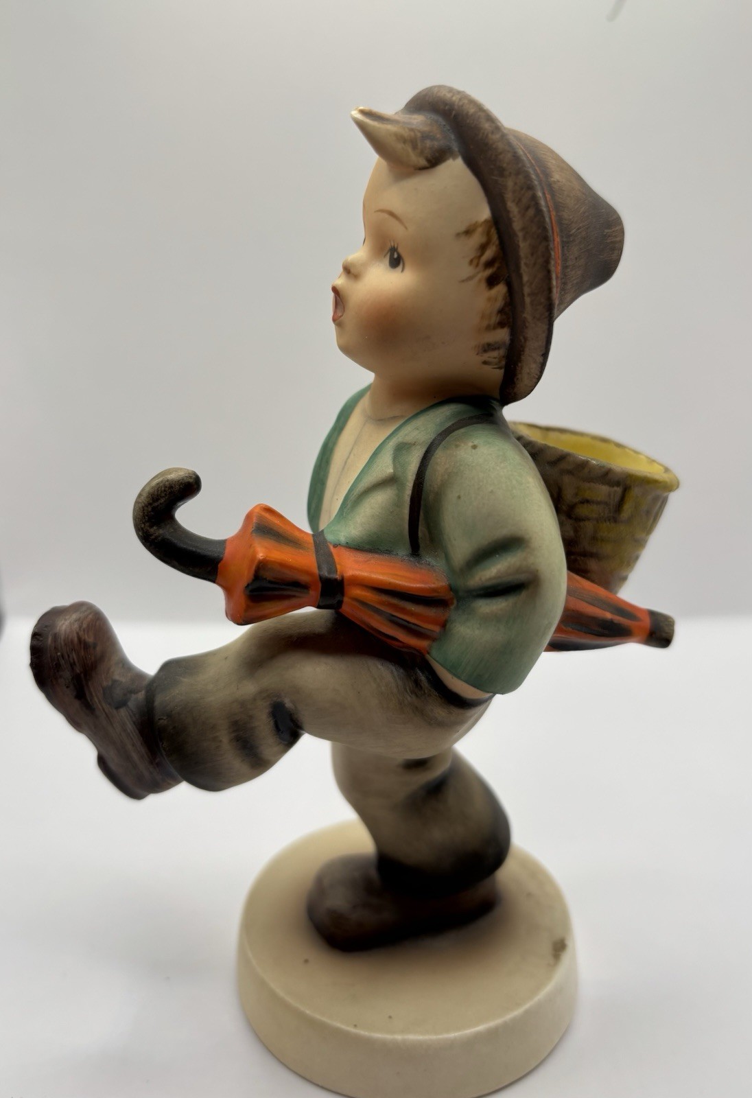 vintage Goebel Hummel figurine titled “Happy Traveler”