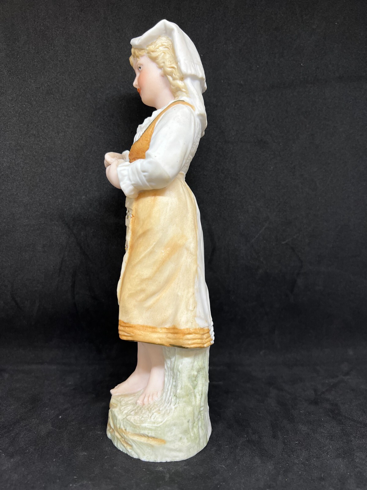 Gebruder Heubach-German Bisque-A Young Barefoot Woman Holding A Apple 10″