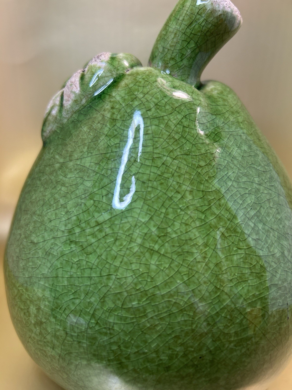 Vintage Mid-Century Modern (MCM) crackle-glazed green ceramic pear figurine.